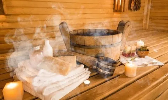 Person relaxing in a sauna after an invigorating heat session