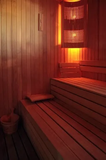 Infrared sauna cabin with warm amber glow