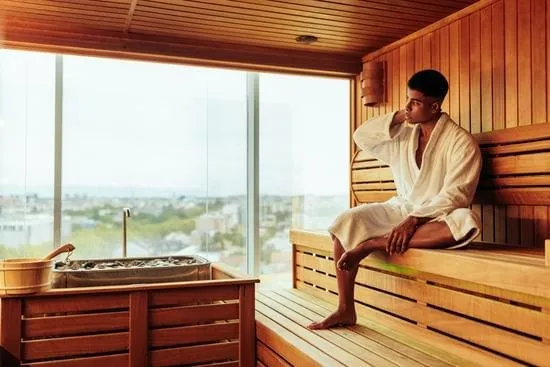 Infrared sauna cabin interior with amber heating elements and timber panelling